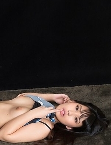 Leggy brunette Kotomi Shinosaki sucking on her finger while showing those legs