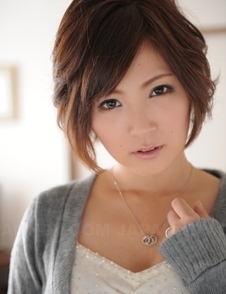 Kaede Oshiro with busy mouth shows sexy legs