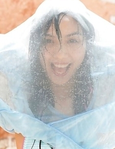 Rola Chen plays with outdoor shower on body over lingerie