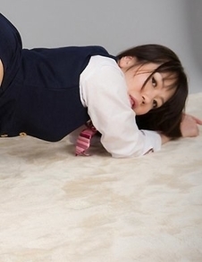 Yuma Miyazaki posing in a uniform and teasing her pussy with a vibrator
