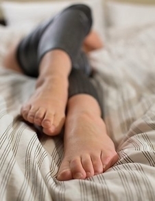 Saori Hirako shows her soles and ass with her silver tights pulled down