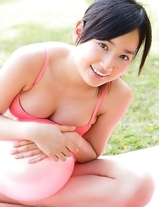 Kaho Takashima in orange swimming suit i playful on beach