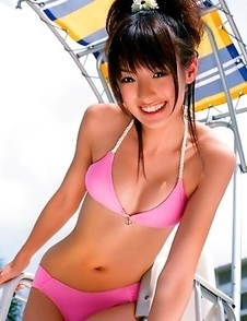 Akina Minami in colorful bath suits plays with big ball