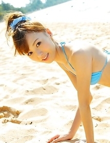 Aino Kishi in blue bath suit is a true beauty enjoying sand