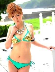 Cute Japanese babe poses outdoor