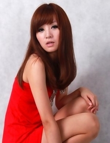 Sandy on heels shows hot behind in red dress for pictures