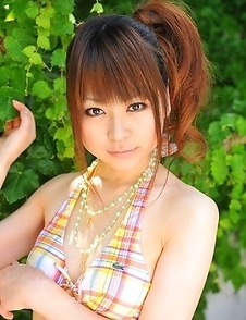 Asian girls pose in bikinis outside