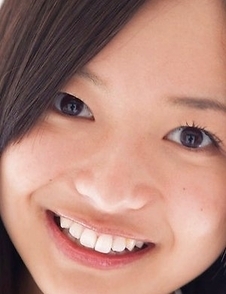 Mayumi Yamanaka smiles while undressing with erotic moves