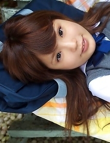 Manami Sato in short uniform skirt spends time in the park