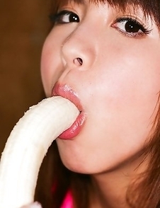 Mai Hagiwara in pink lingerie plays with lips on banana