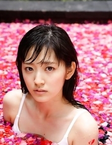 Airi Suzuki in bath suit enjoys petals all over her body