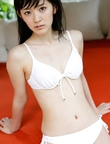 Airi Suzuki in bath suit enjoys petals all over her body