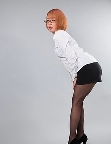 Nerdy redhead with glasses Chie Kobayashi giving a great footjob in a POV gallery