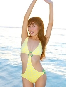 Nozomi Kawasaki in yellow bath suit enjoys the sun and sea