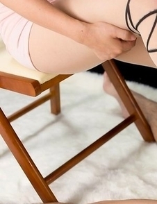 Strict seductress Kaede Oshiro flattens this dude's cock and balls for his pleasure